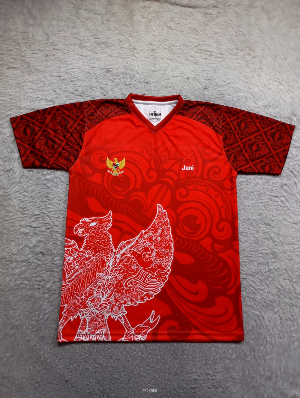 Jersey Merah Garuda Indonesia dengan Motif Batik dan Nama 'Juni' - Jersey Custom PROKAOS