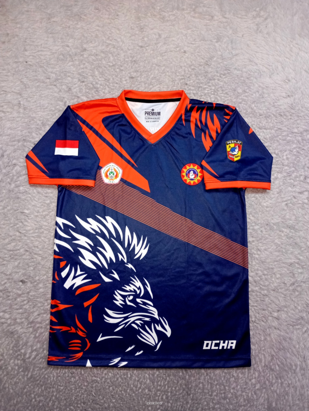 Jersey Olahraga Biru-Oranye dengan Motif Kepala Singa - Jersey Custom PROKAOS