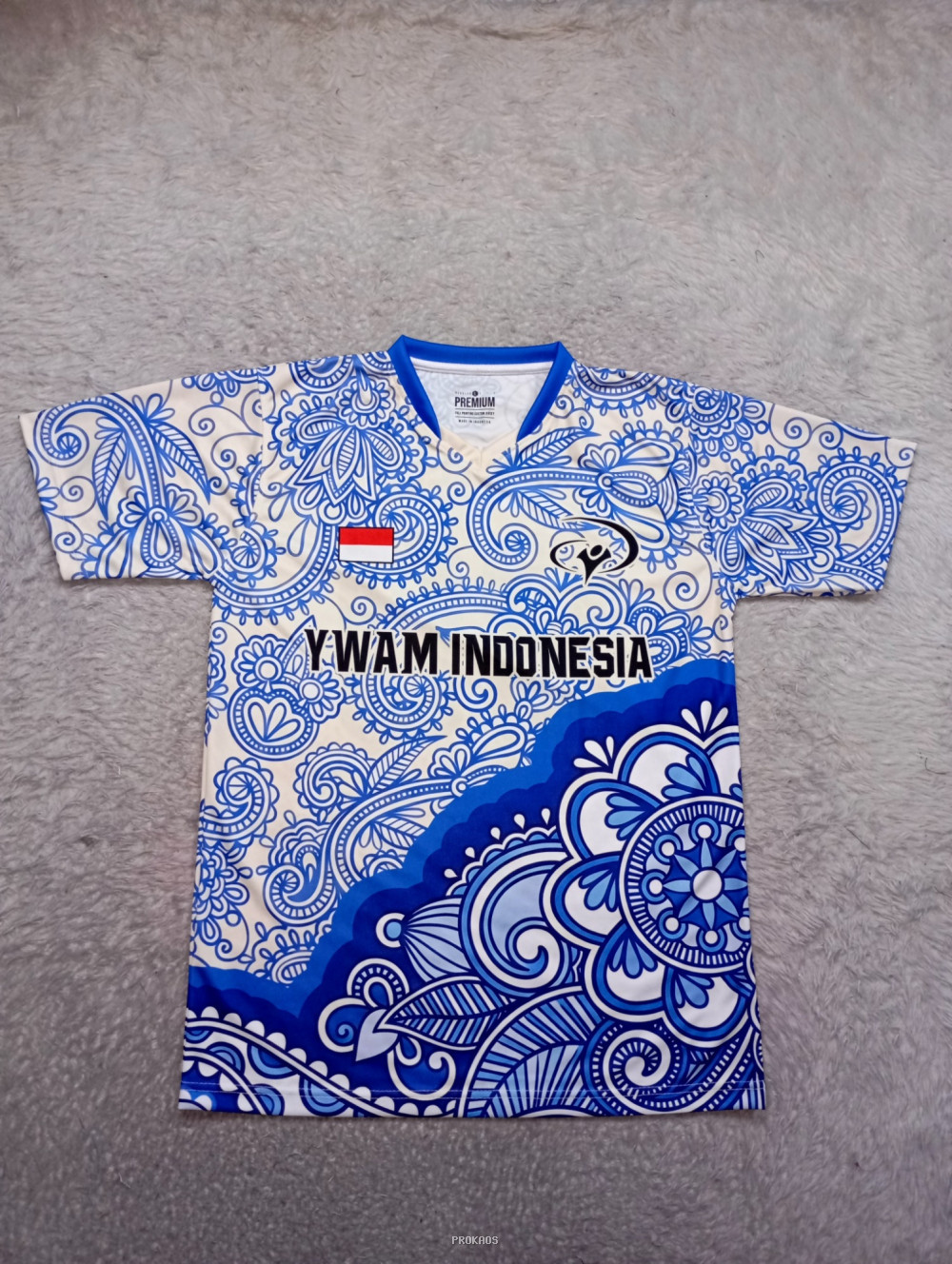 Jersey YWAM Indonesia: Motif Batik Biru-Putih & Logo - Jersey Custom PROKAOS