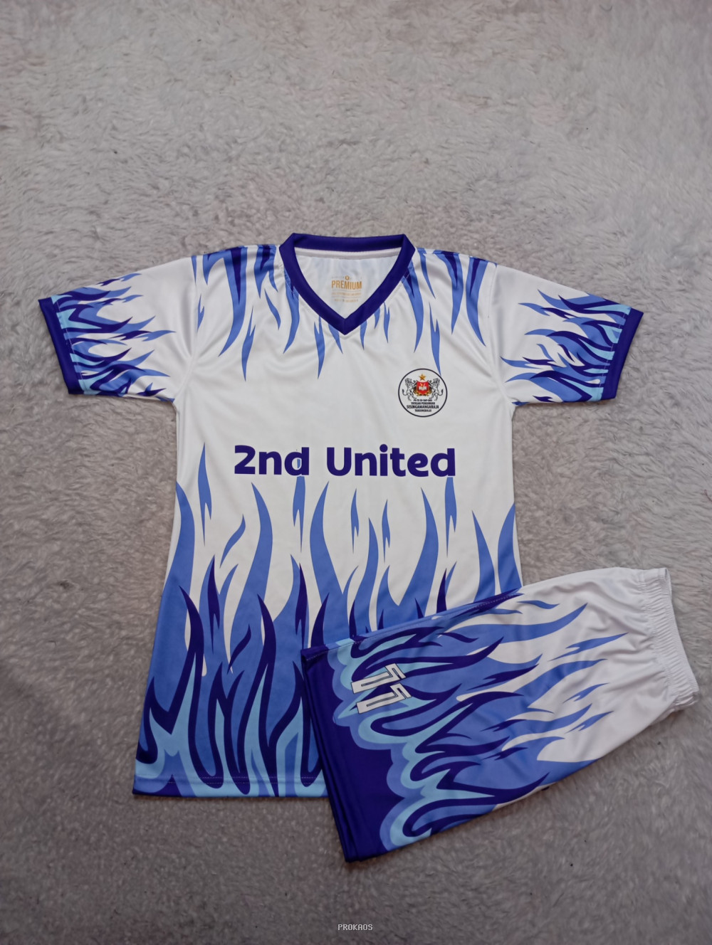 Jersey 2nd United: Putih dengan Motif Api Biru - Jersey Custom PROKAOS