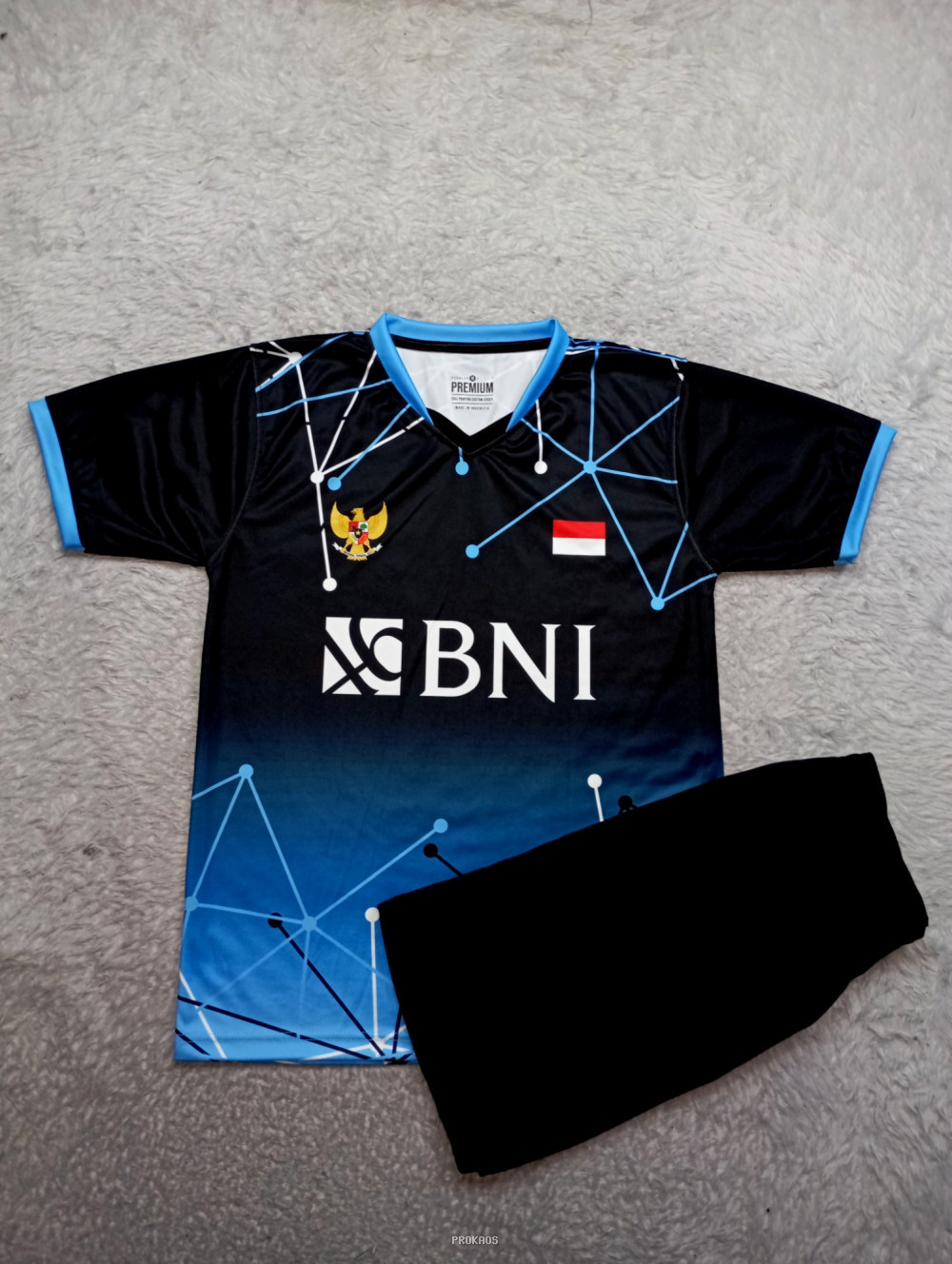 Jersey BNI Hitam dengan Motif Jaring Biru dan Logo Garuda - Jersey Custom PROKAOS