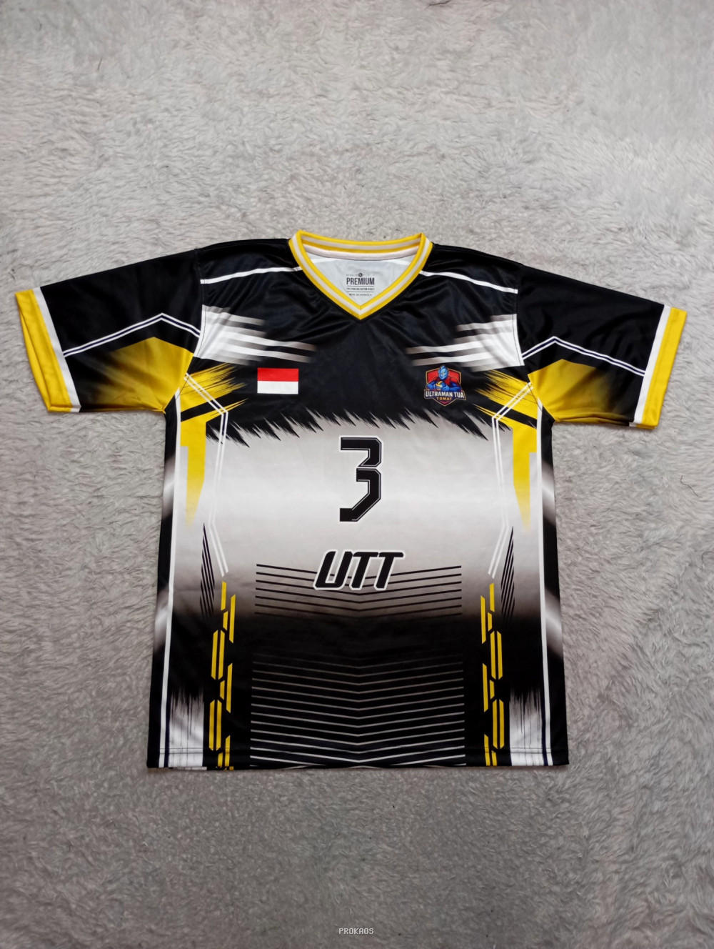Jersey Bola UTT: Dominasi Hitam, Kuning, & Desain Dinamis - Jersey Custom PROKAOS