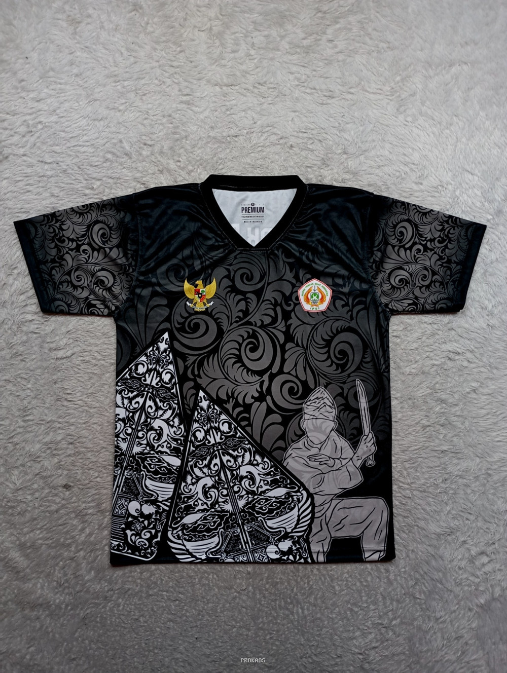 Jersey Hitam Motif Ukir dengan Lambang Garuda dan Tokoh - Jersey Custom PROKAOS