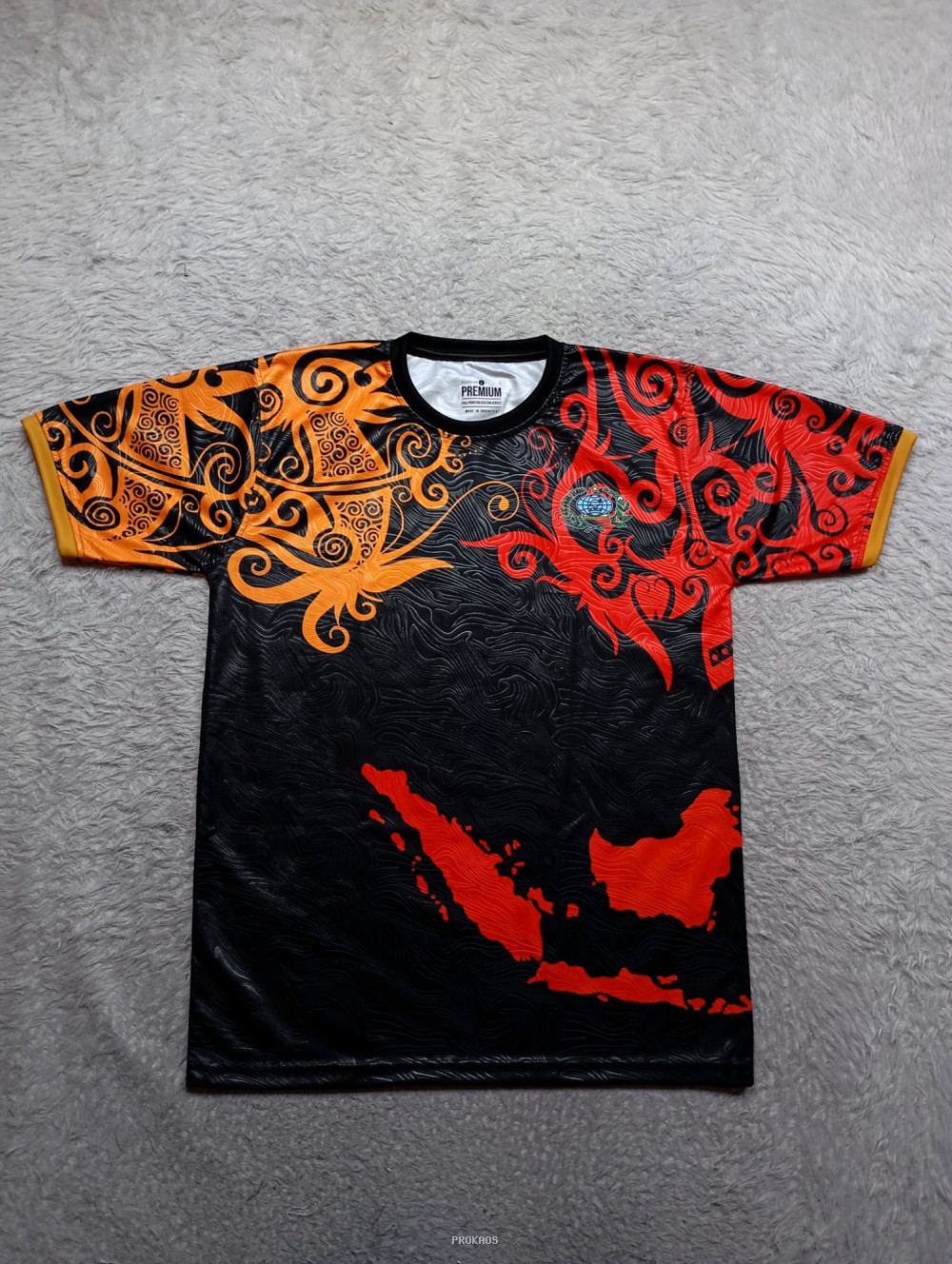 Jersey Motif Etnik Indonesia: Perpaduan Oranye, Merah, dan Hitam - Jersey Custom PROKAOS