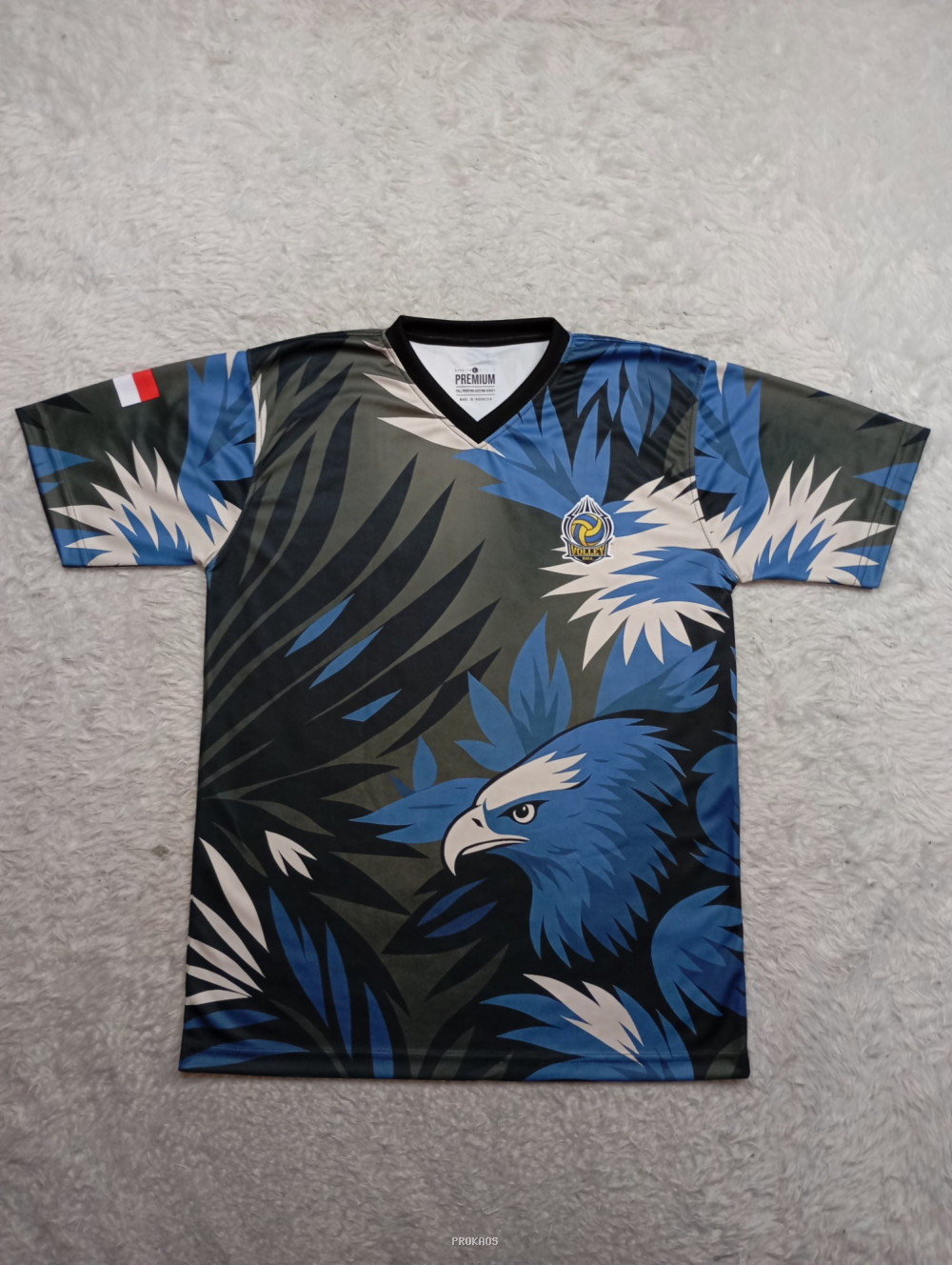 Jersey Voli: Elang Biru di Tengah Rimbun Daun Tropis - Jersey Custom PROKAOS